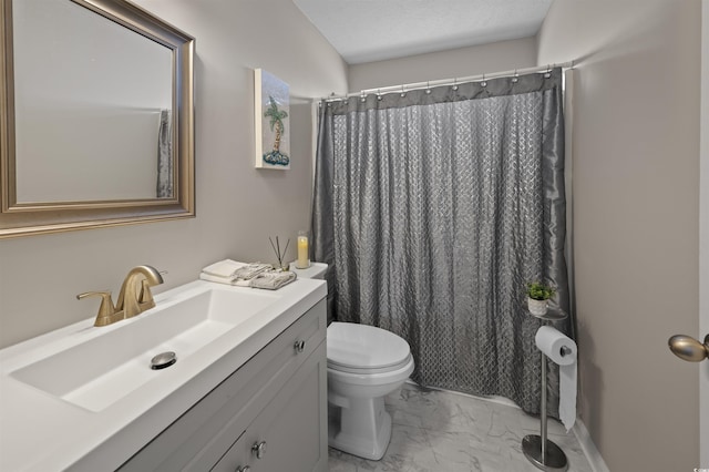 bathroom with vanity, a shower with shower curtain, a textured ceiling, toilet, and marble finish floor