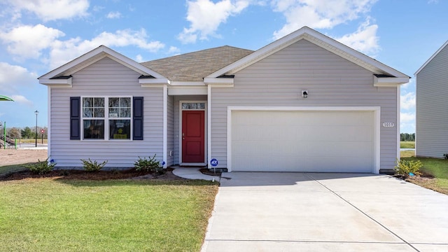 ranch-style house featuring concrete driveway, an attached garage, and a front yard