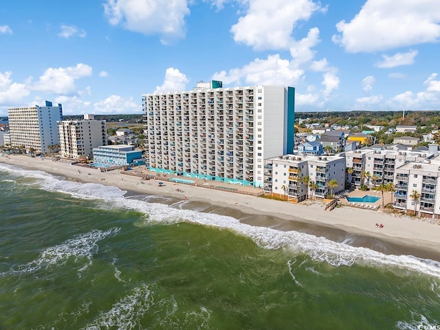 bird's eye view featuring a view of city, a water view, and a view of the beach