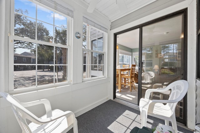 sunroom / solarium with beamed ceiling