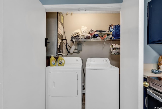 clothes washing area with washer and dryer and laundry area