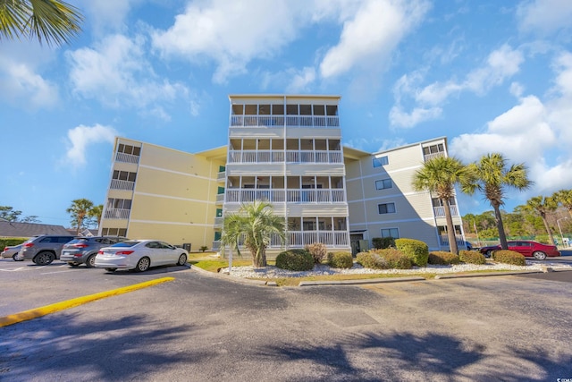 view of property with uncovered parking