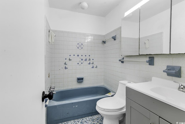 full bath featuring tile walls, toilet, vanity, shower / bathtub combination, and backsplash