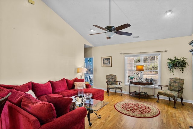 living room with baseboards, visible vents, lofted ceiling, ceiling fan, and wood finished floors