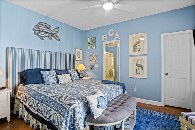 bedroom with wood finished floors, a ceiling fan, and baseboards