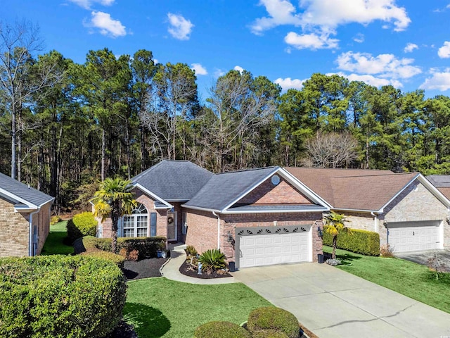 ranch-style house featuring a garage, brick siding, concrete driveway, roof with shingles, and a front yard