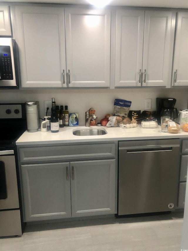 bar with stainless steel appliances and a sink