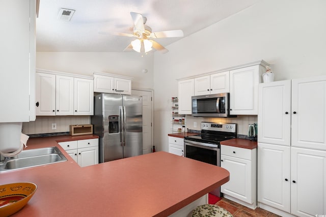 kitchen featuring stainless steel appliances, visible vents, a sink, and white cabinetry