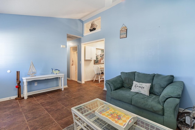 living room with baseboards and vaulted ceiling