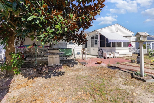 back of house featuring a patio area and fence