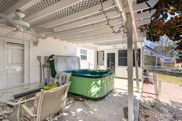 view of patio / terrace featuring ceiling fan and fence