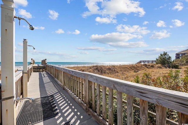 view of community with a view of the beach and a water view