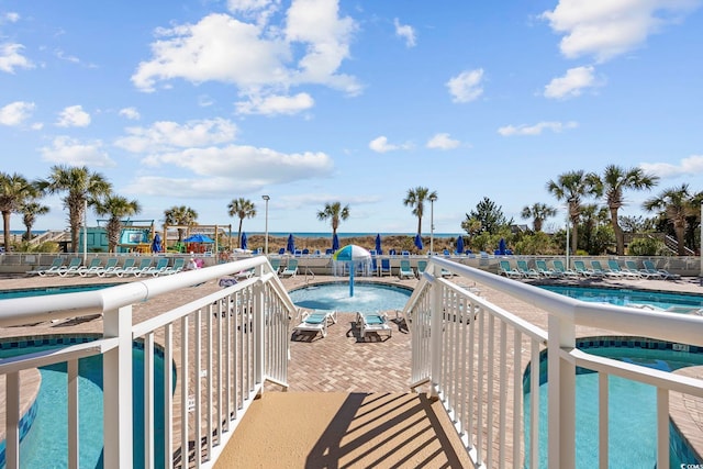 pool featuring a hot tub