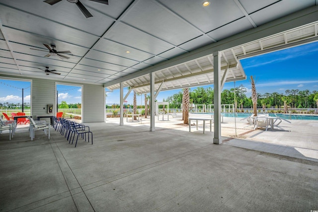 view of patio with a ceiling fan, a community pool, and fence