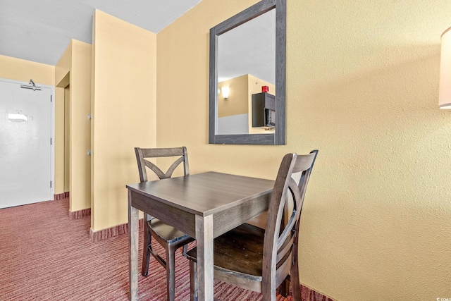 1501 S Ocean Blvd Unit 1005, Myrtle Beach, SC 29577 - carpeted dining room featuring a textured wall