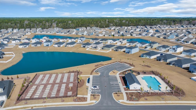 birds eye view of property featuring a water view and a residential view