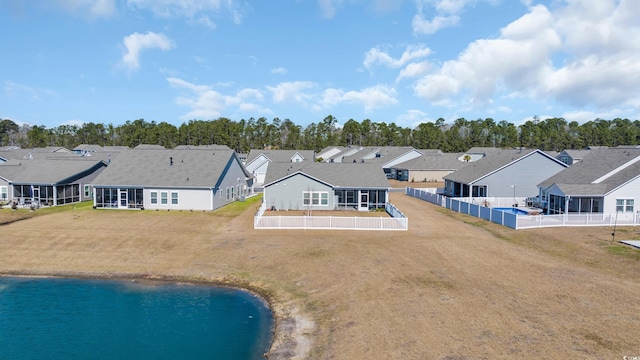 exterior space with a water view and a residential view