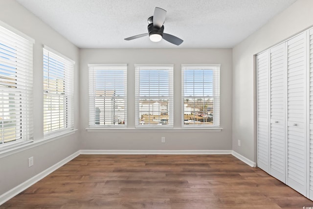 interior space with a healthy amount of sunlight and ceiling fan