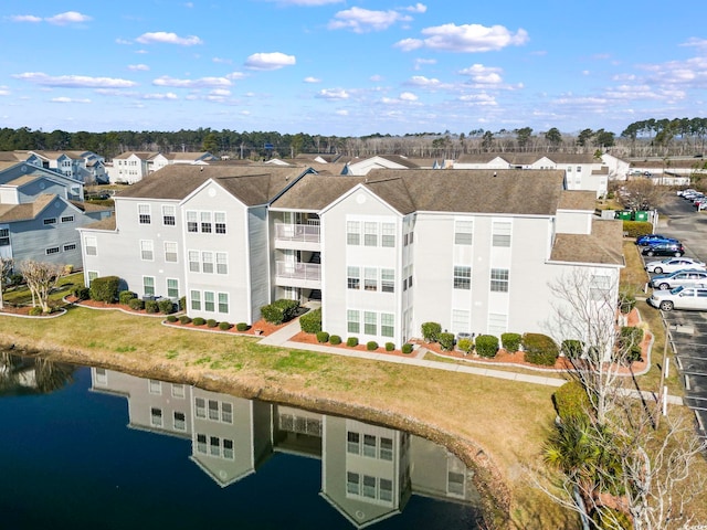 aerial view featuring a water view and a residential view