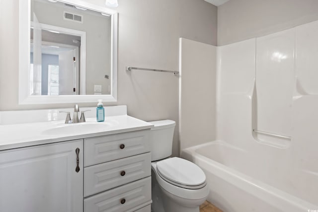 bathroom with visible vents, vanity, and toilet