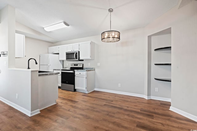 kitchen featuring a chandelier, stainless steel appliances, dark wood-style flooring, baseboards, and white cabinets