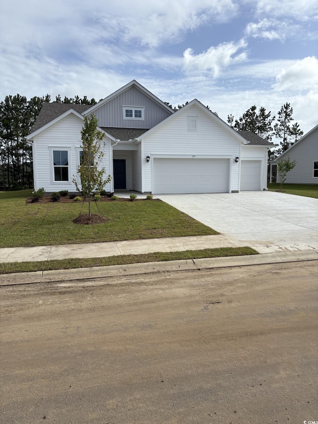179 Glengrove Ln, Murrells Inlet, SC 29576 - modern farmhouse featuring board and batten siding, a garage, driveway, and a front yard