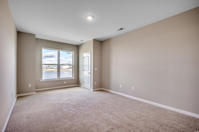179 Glengrove Ln, Murrells Inlet, SC 29576 - unfurnished room with baseboards, light colored carpet, and visible vents
