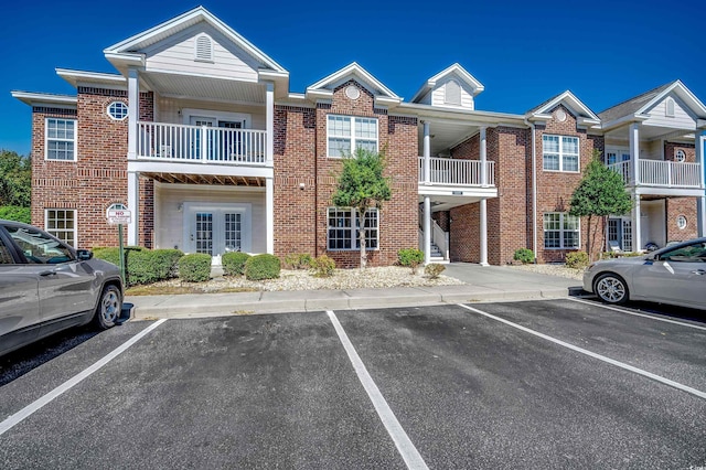 view of property with uncovered parking