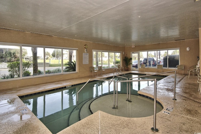 community pool with an indoor hot tub