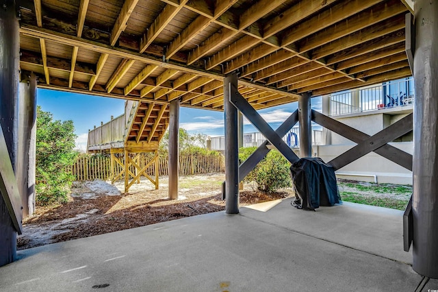 view of patio / terrace with stairway and fence