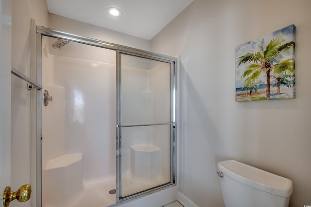 bathroom featuring recessed lighting, a shower stall, and toilet