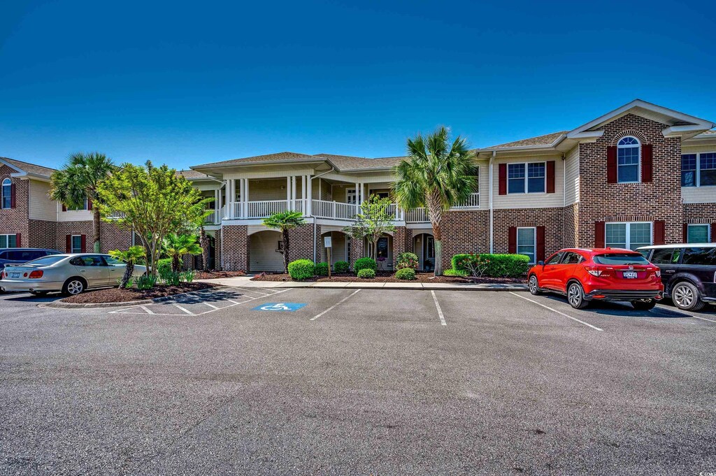 700 Pickering Dr Unit 103, Murrells Inlet, SC 29576 - view of building exterior with uncovered parking