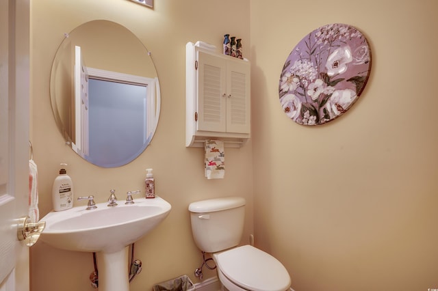 bathroom featuring a sink and toilet
