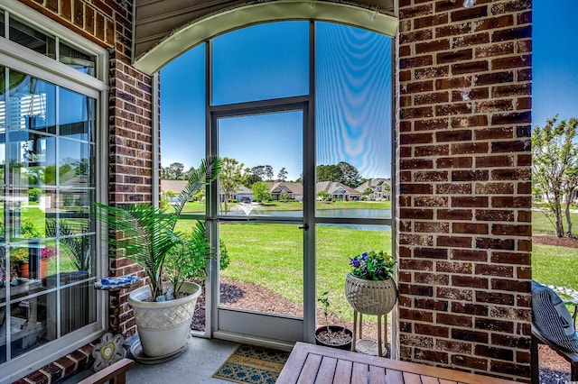 sunroom with a water view