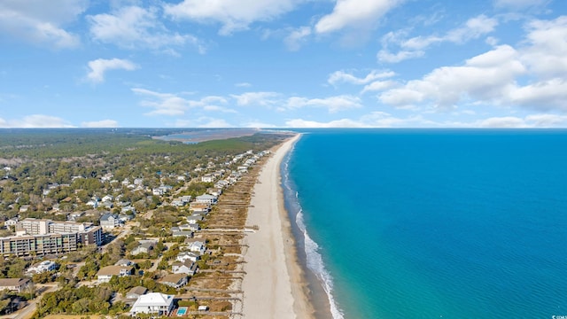 bird's eye view featuring a view of the beach and a water view