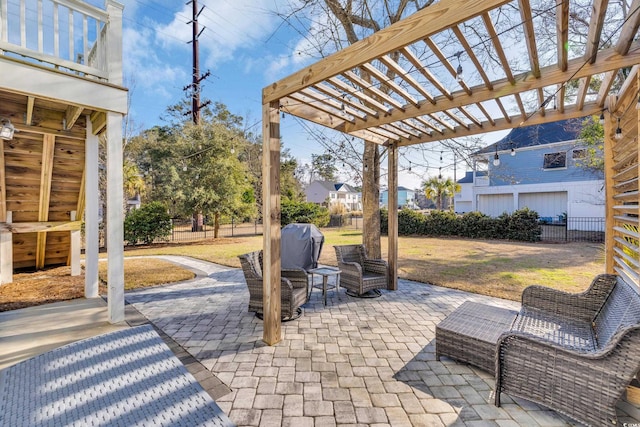 view of patio featuring a balcony, fence, and a pergola