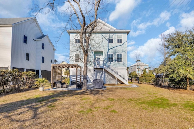 back of house with stairs, a yard, fence, and a pergola