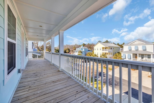 wooden deck with a residential view