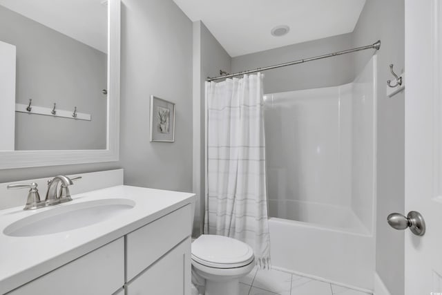 bathroom with toilet, marble finish floor, shower / bath combo, and vanity