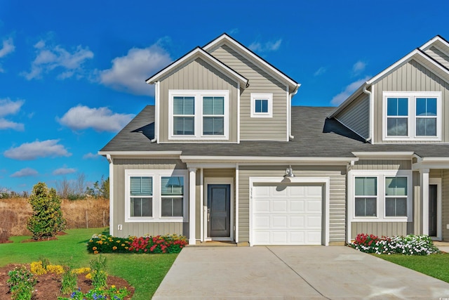 view of front of home featuring a front lawn, board and batten siding, and driveway