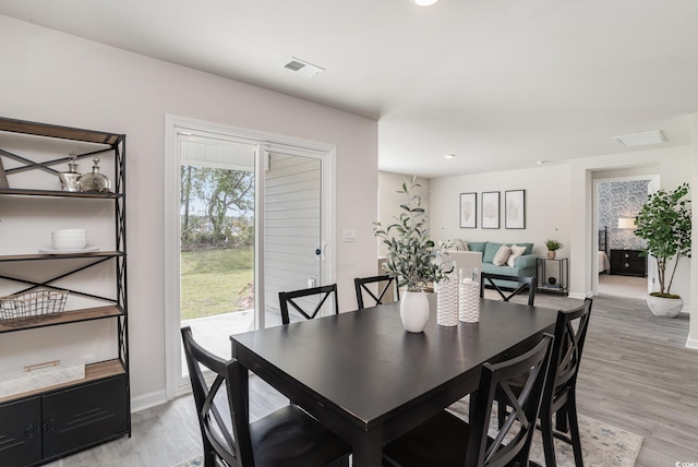 dining area featuring recessed lighting, visible vents, light wood-style flooring, and baseboards