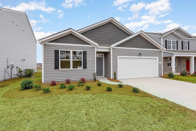 view of front facade with a garage, concrete driveway, and a front yard