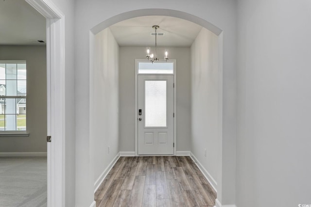 4036 Bucolic Loop, Myrtle Beach, SC 29588 - entryway with wood finished floors, arched walkways, a chandelier, and healthy amount of natural light