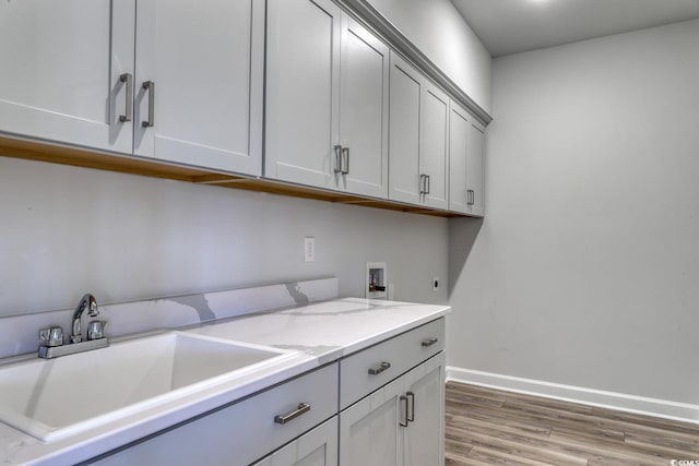 4036 Bucolic Loop, Myrtle Beach, SC 29588 - laundry room featuring cabinet space, washer hookup, hookup for an electric dryer, and light wood-style floors