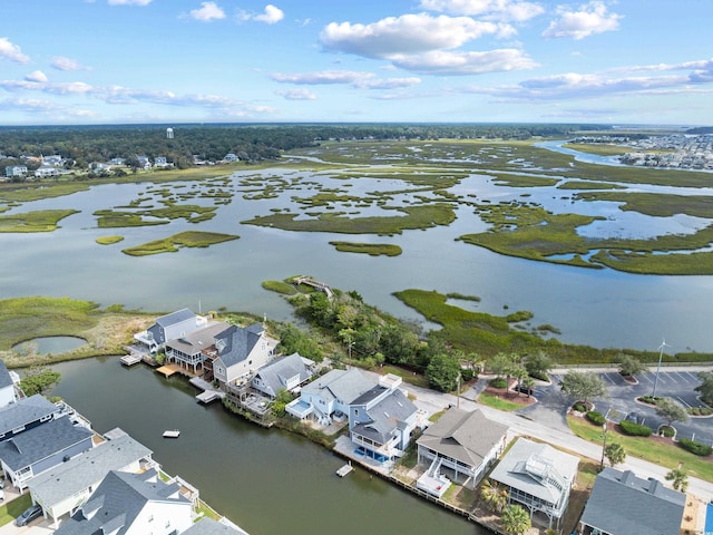 drone / aerial view with a water view and a residential view