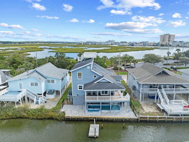 aerial view featuring a residential view and a water view