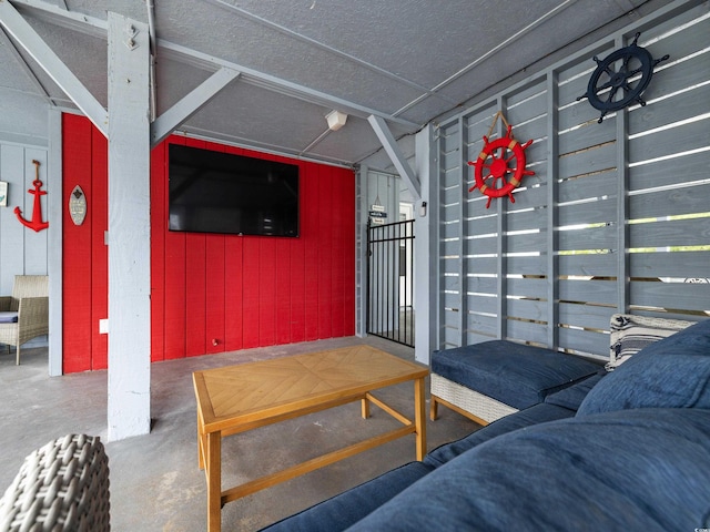 living area with concrete flooring