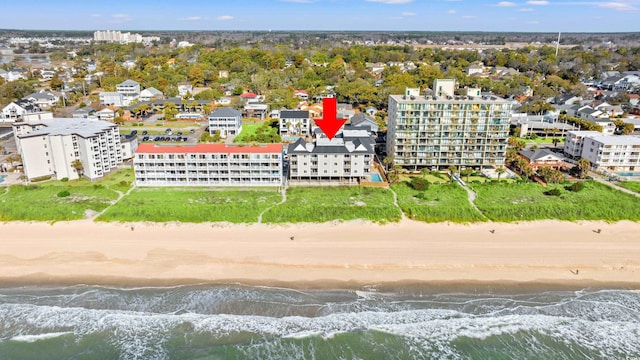 birds eye view of property featuring a water view and a view of the beach