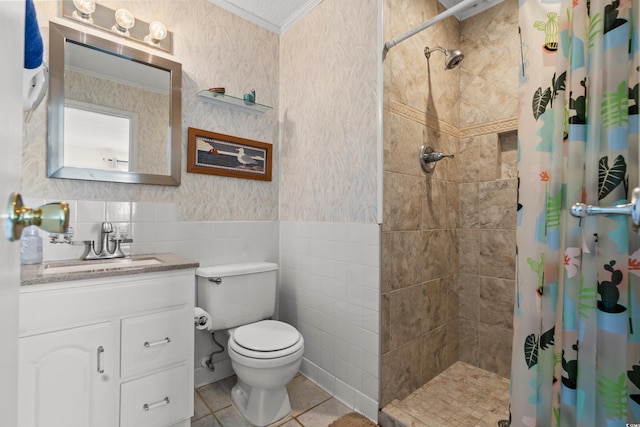 bathroom with wallpapered walls, tiled shower, wainscoting, ornamental molding, and tile walls