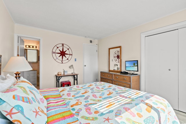 bedroom featuring a closet and visible vents